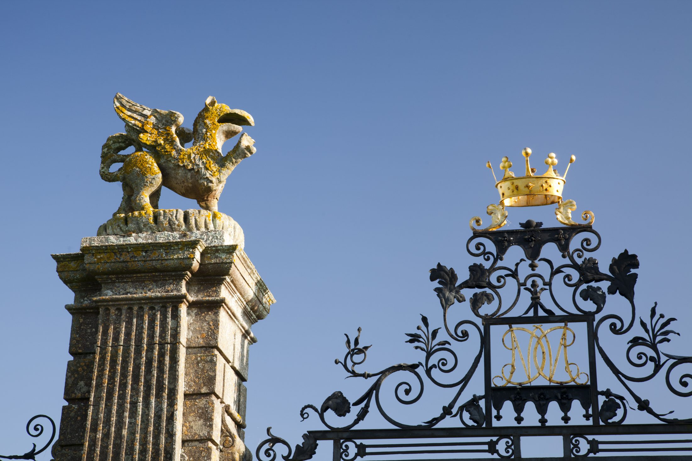 Gate piers topped with gilded heraldic beasts