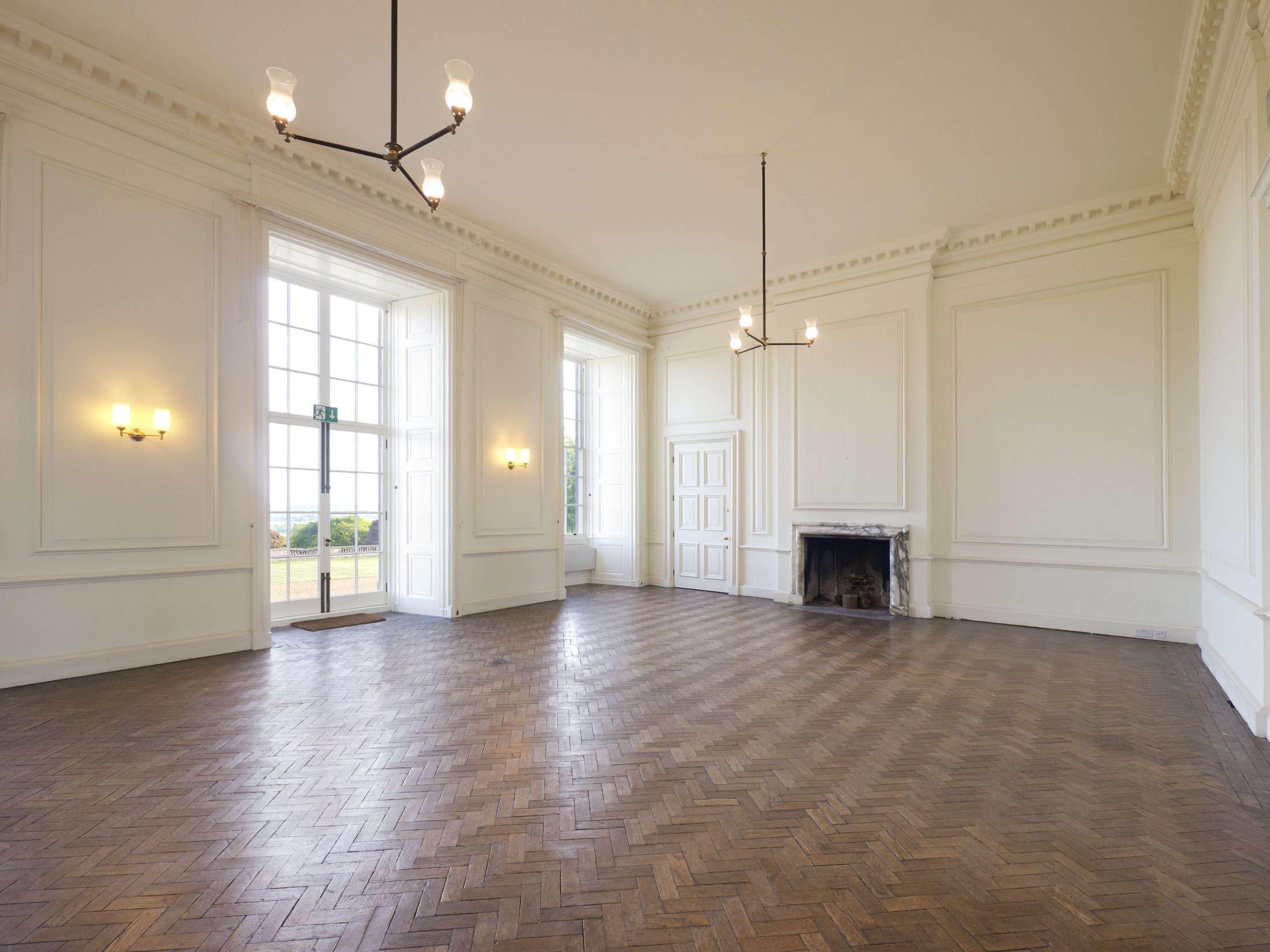 The Garden Saloon, with herringbone parquet and French doors onto the garden terrace