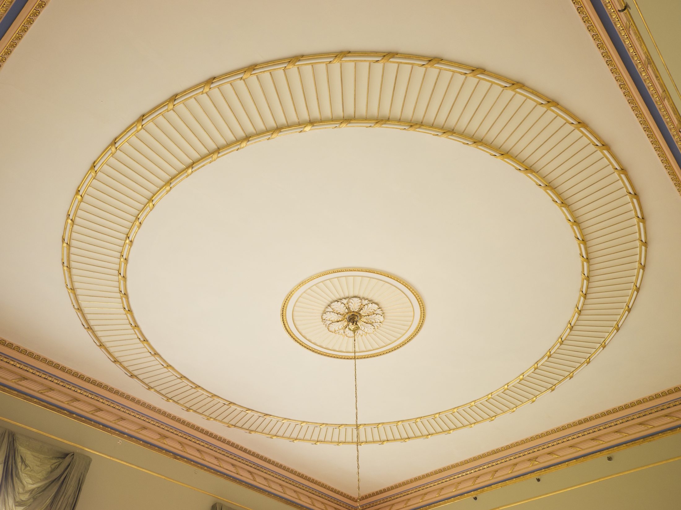 A plain oval ceiling with a gilded band, in the Drawing Room