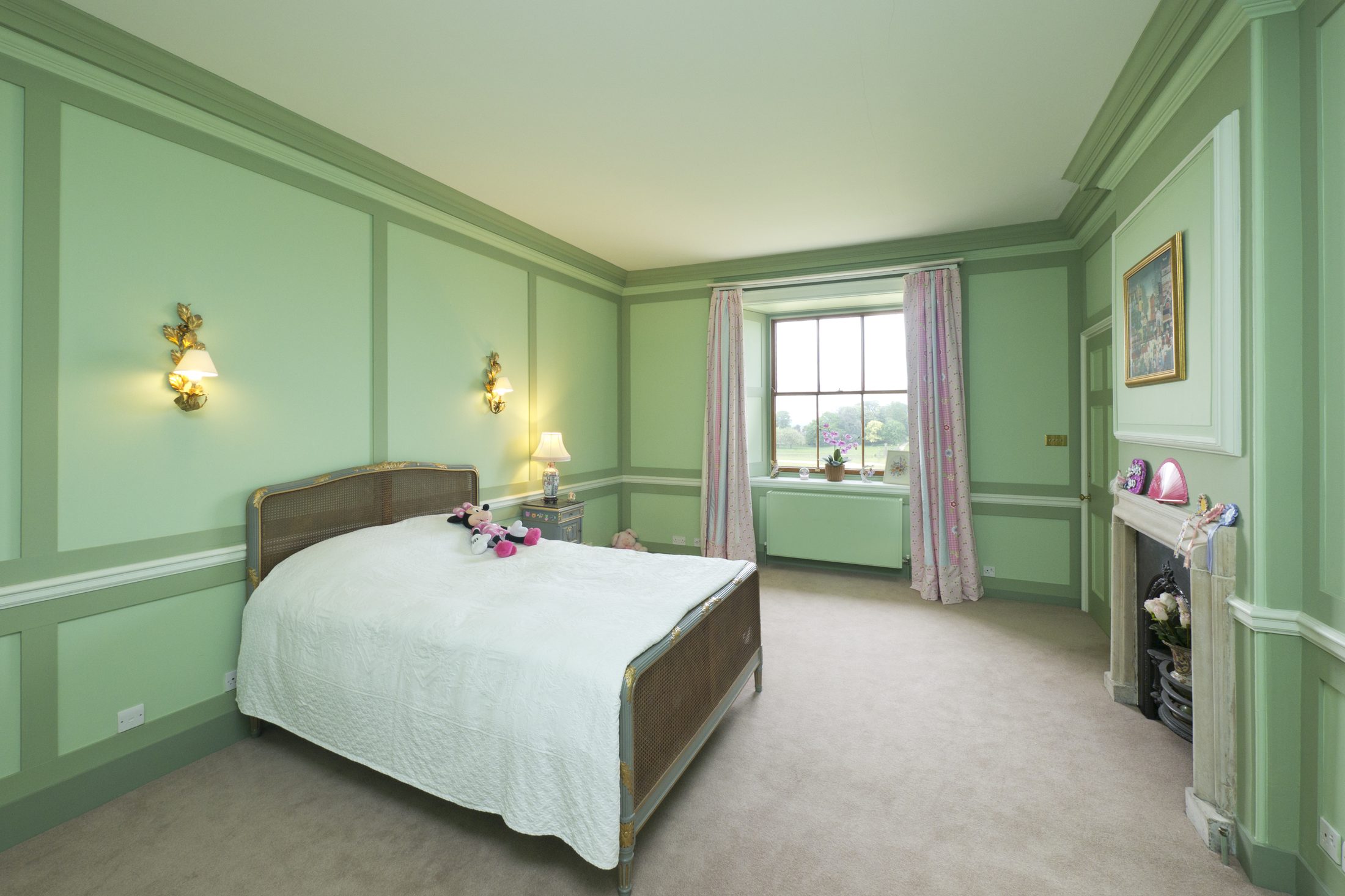 Bedroom 4, with pale green walls and a fireplace
