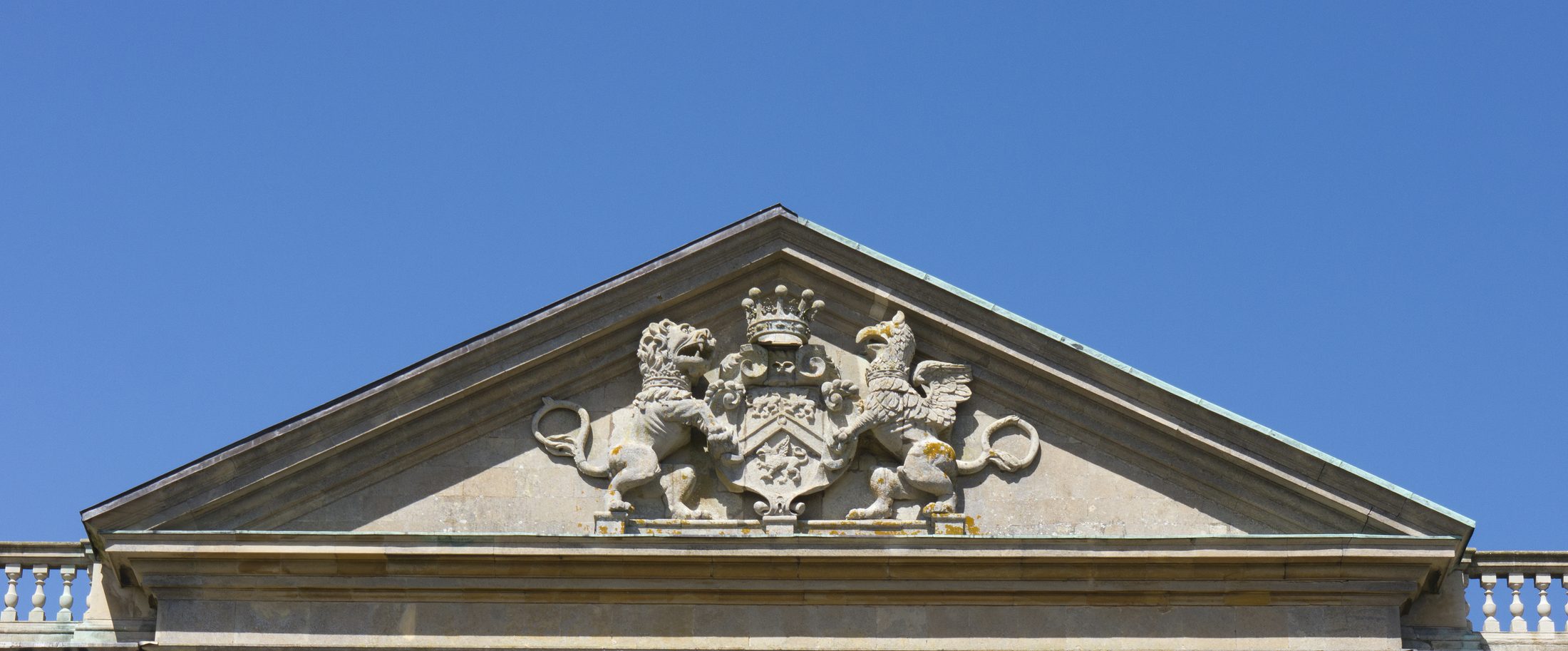 The family coat of arms on the roofline