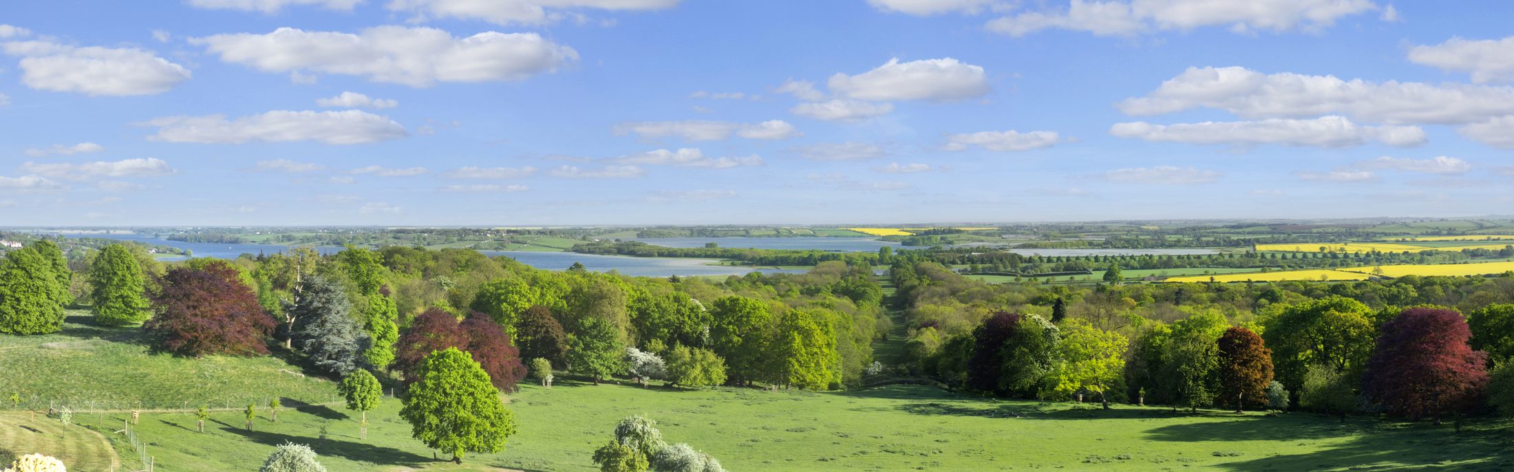 A wide panorama of the view south from the house towards Rutland Water